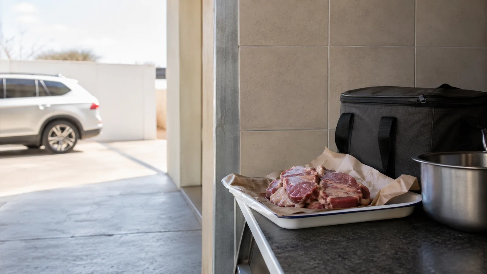 Fresh meat on a Gaborone household counter contrasts with a calm, open domestic scene, without prices or retail claims.